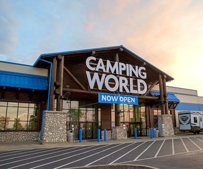 A large building with a sign on the front that spells out 'Camping World'