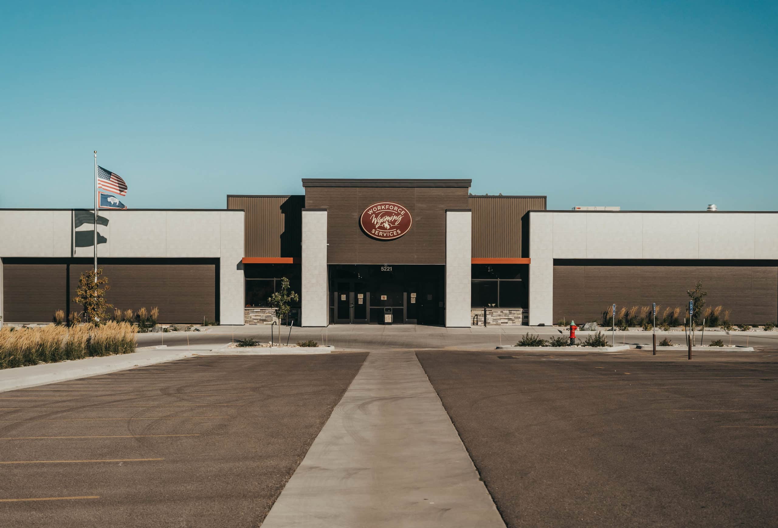 A large building with a sign on the front that spells out 'Wyoming Workforce'