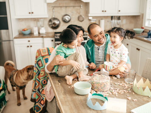 Family Of Four In Warm, Cozy Home